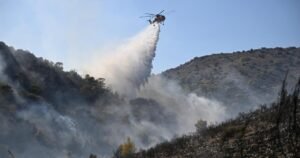 Read more about the article Firefighters battle massive wildfires in Belgium and Greece as 2 die on an island near Athens